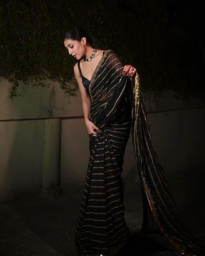 Full black and gold sequins stripe georgette saree with stitched blouse