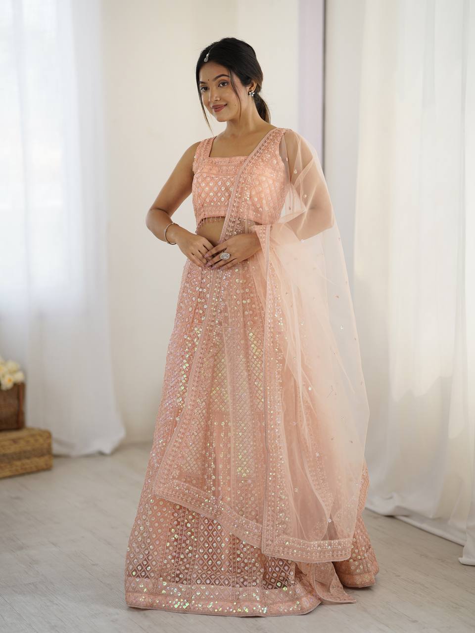 Kruti - Beautiful Pastel Peach Net Lehenga with Rainbow Sequins Fully Stitched