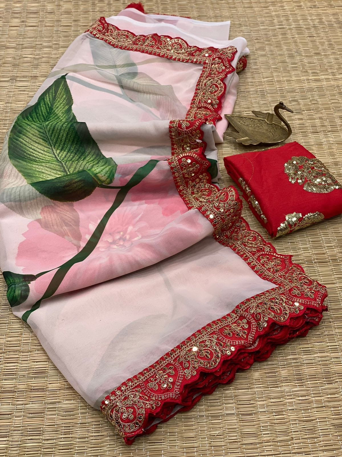 Pastel floral saree with lace border work with stitched blouse