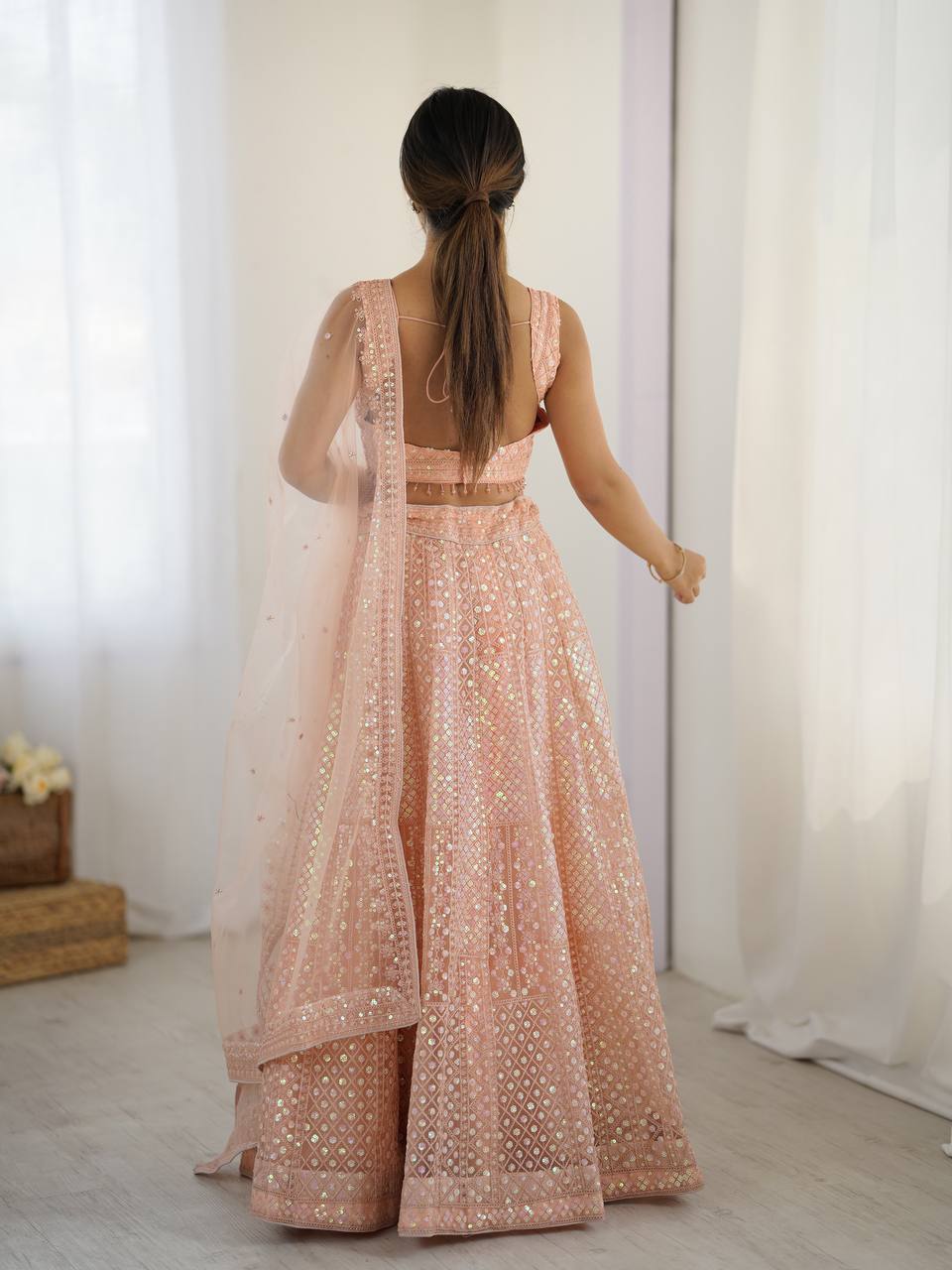 Kruti - Beautiful Pastel Peach Net Lehenga with Rainbow Sequins Fully Stitched