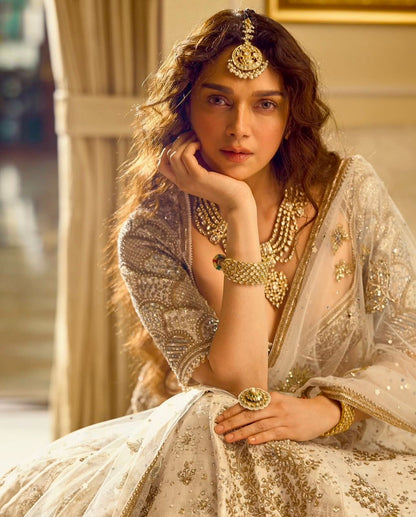 Aditi - Premium Silk Cream Heavy Embroidered Zari Lehenga Fully Stitched