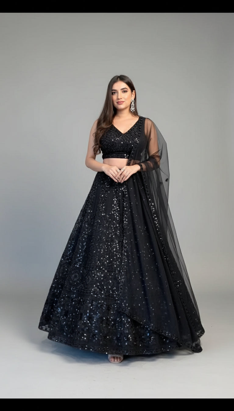 Woman wearing a black sequined dress in an indoor setting