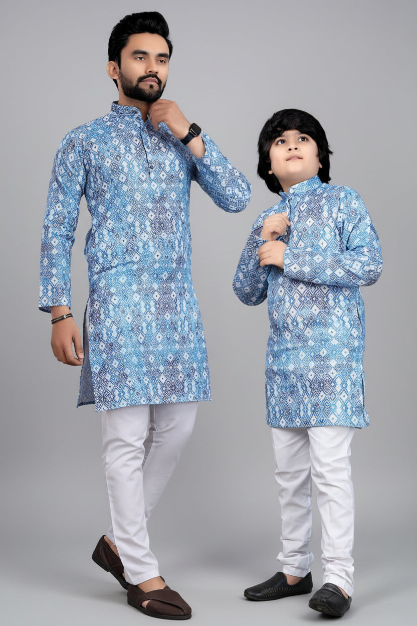 Man and child wearing matching blue floral kurta sets with a brown background