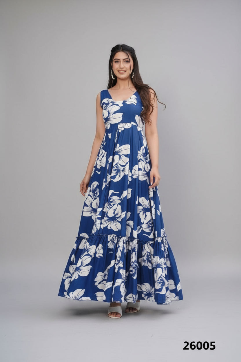 Woman wearing a blue floral dress standing by a poolside.