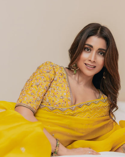 Mustard organza with sequins work celebrity style saree with stitched blouse