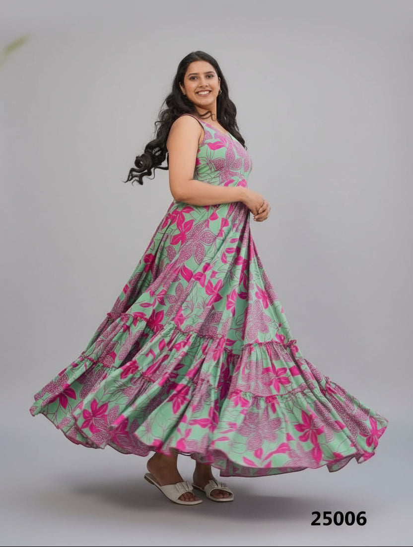 Woman in a floral dress standing by a pool with a building and plants in the background