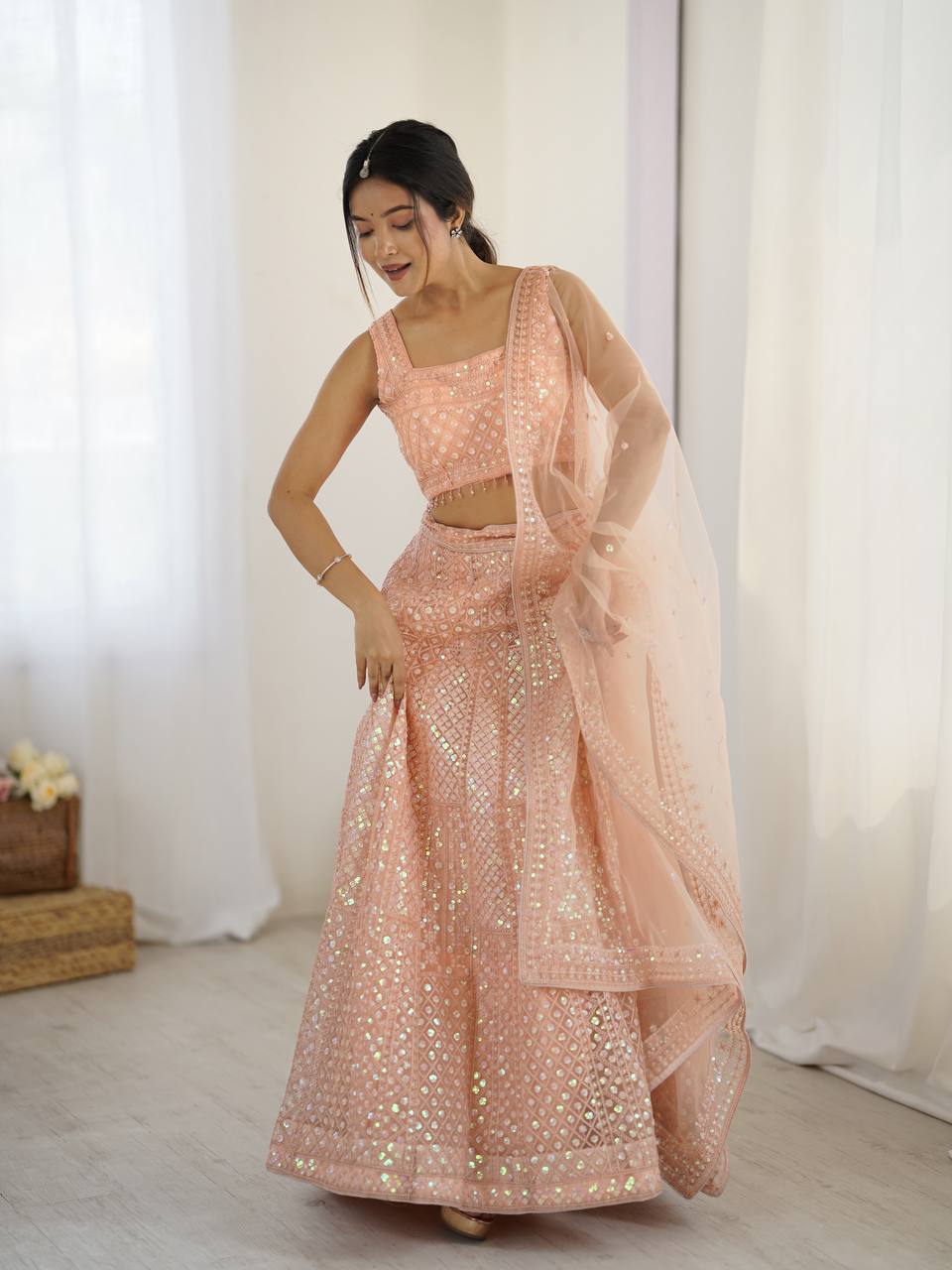 Kruti - Beautiful Pastel Peach Net Lehenga with Rainbow Sequins Fully Stitched